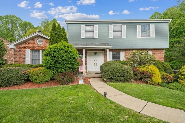 620 Sandy Hill Rd, Manor, PA 15642 - view of front of home featuring a front lawn and brick siding