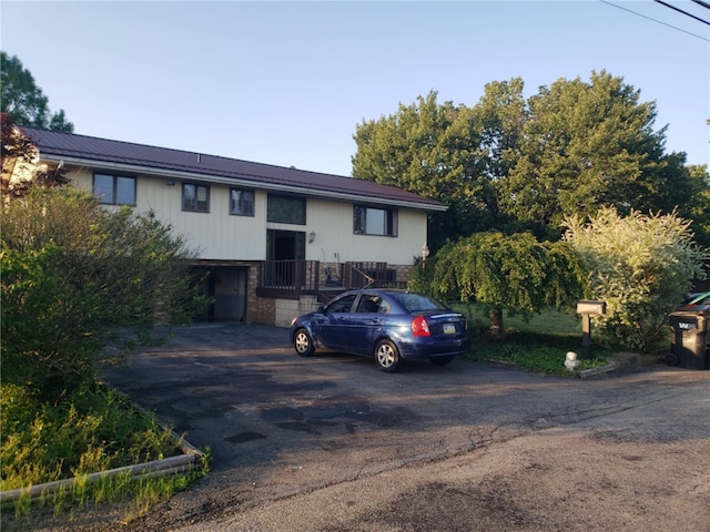 105 Lawrence Ave, Twp Of But Nw, PA 16001 - raised ranch with a metal roof, asphalt driveway, and brick siding