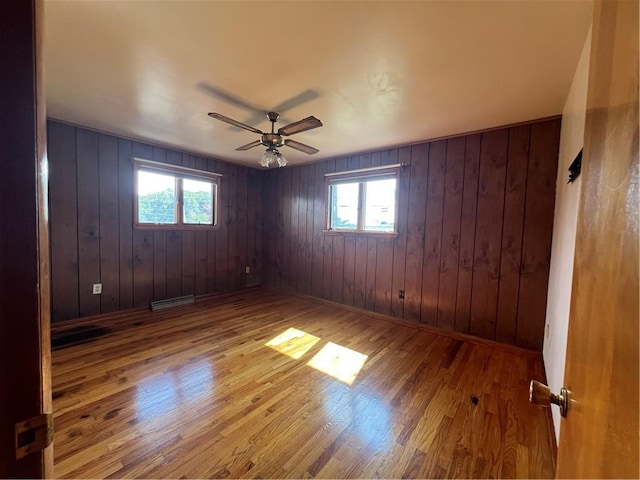 105 Lawrence Ave, Twp Of But Nw, PA 16001 - unfurnished room with a ceiling fan, healthy amount of natural light, wood finished floors, and wooden walls