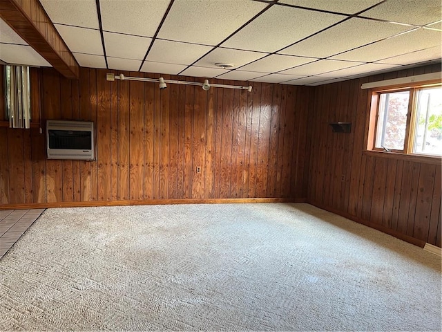 105 Lawrence Ave, Twp Of But Nw, PA 16001 - basement with light colored carpet, a drop ceiling, wood walls, and heating unit