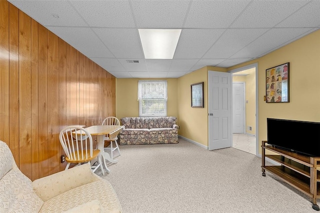 103 Boxwood Ct, Peters Twp, PA 15317 - living area featuring a drop ceiling, wooden walls, and carpet flooring