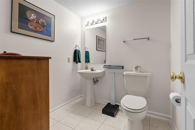 103 Boxwood Ct, Peters Twp, PA 15317 - half bath featuring tile patterned flooring, toilet, baseboards, and a sink