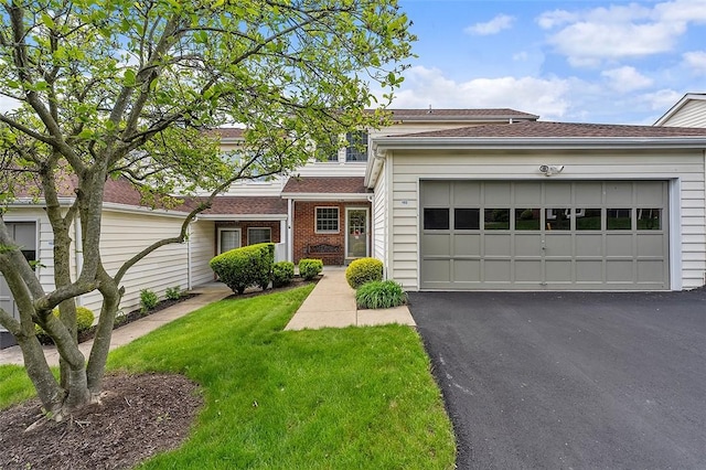 103 Boxwood Ct, Peters Twp, PA 15317 - view of front facade featuring a garage, driveway, a front lawn, and brick siding