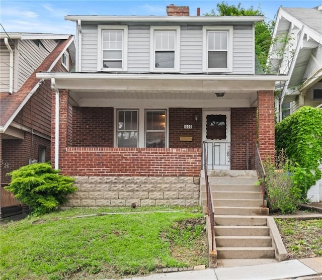 1534 Dormont Ave, Dormont, PA 15216 - traditional style home with brick siding, a porch, and a chimney