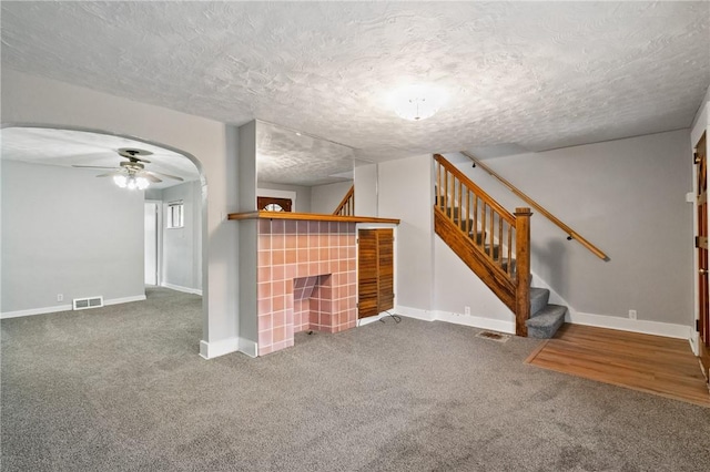 1534 Dormont Ave, Dormont, PA 15216 - unfurnished living room with ceiling fan, stairway, carpet, baseboards, and a textured ceiling