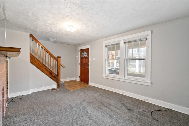 1534 Dormont Ave, Dormont, PA 15216 - foyer entrance with carpet floors, stairway, baseboards, and a textured ceiling