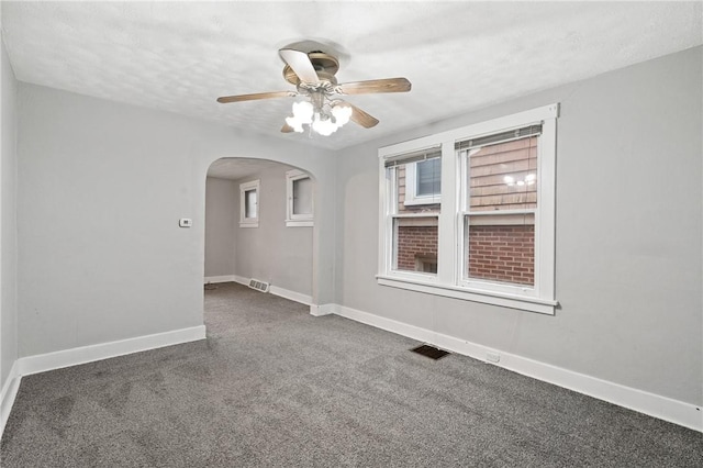 1534 Dormont Ave, Dormont, PA 15216 - unfurnished room featuring arched walkways, baseboards, ceiling fan, and carpet