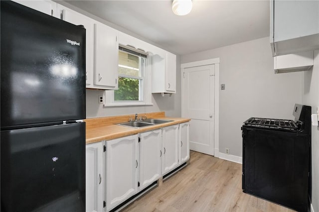 1534 Dormont Ave, Dormont, PA 15216 - kitchen featuring black appliances, a sink, white cabinetry, and light wood-style floors