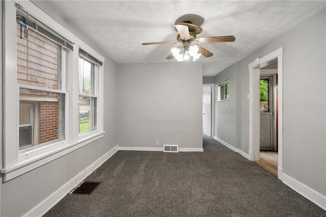 1534 Dormont Ave, Dormont, PA 15216 - spare room featuring dark colored carpet, baseboards, and ceiling fan