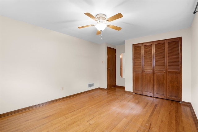 2023 Menold Dr, Mccandless, PA 15101 - unfurnished bedroom with light wood finished floors, baseboards, a closet, and a ceiling fan
