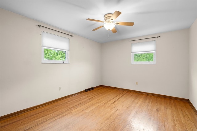 2023 Menold Dr, Mccandless, PA 15101 - unfurnished room featuring healthy amount of natural light, baseboards, light wood-style floors, and a ceiling fan