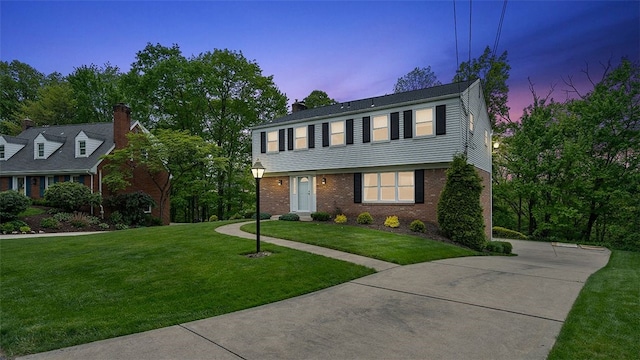 2023 Menold Dr, Mccandless, PA 15101 - colonial house with a yard and brick siding