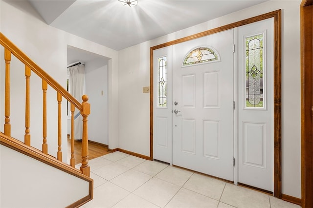 2023 Menold Dr, Mccandless, PA 15101 - foyer entrance with stairway, light tile patterned flooring, and baseboards