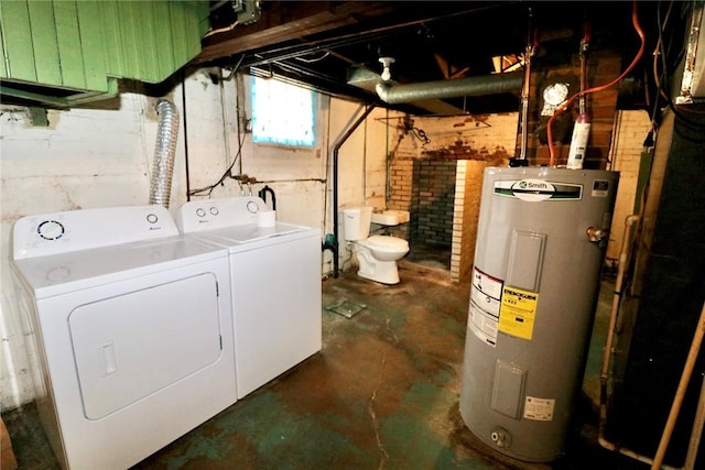 clothes washing area featuring electric water heater and separate washer and dryer