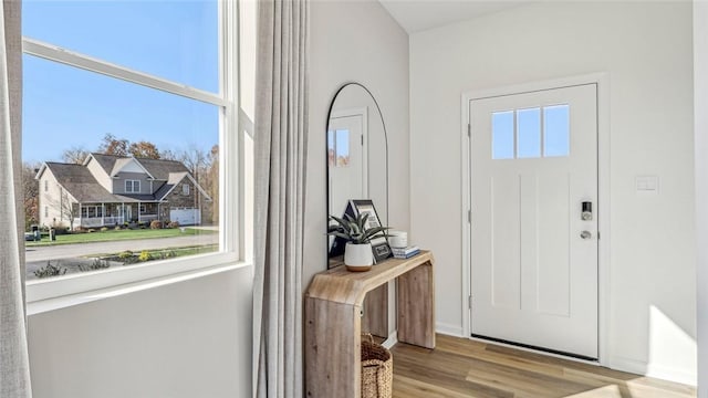 foyer entrance with wood finished floors