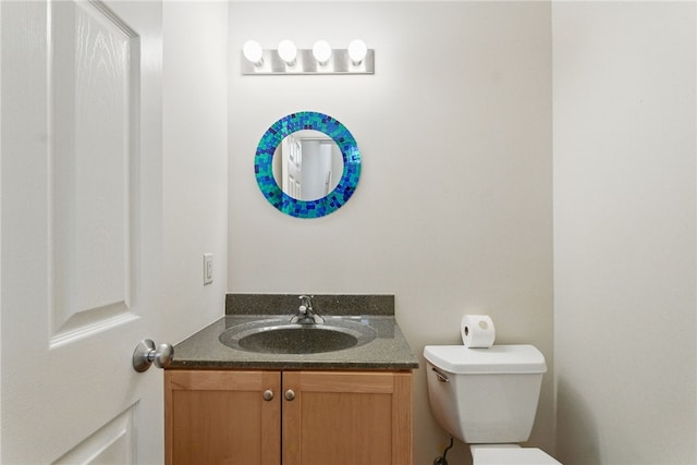 half bath with toilet and vanity