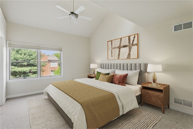 bedroom with light colored carpet, vaulted ceiling, baseboards, and ceiling fan