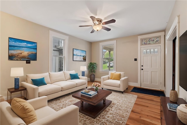 813 11th Ave, New Brighton, PA 15066 - living room with light wood-style flooring, ceiling fan, and baseboards