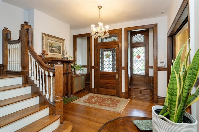 6020 Grafton St, Highland Park, PA 15206 - foyer with wood finished floors, a chandelier, and stairway