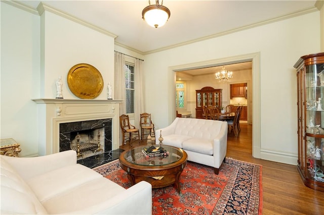 6020 Grafton St, Highland Park, PA 15206 - living area featuring wood finished floors, crown molding, a chandelier, and a high end fireplace
