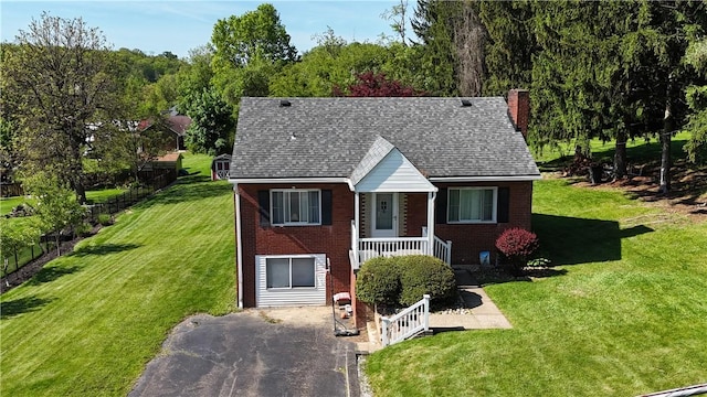 116 Diebold Rd, Robinson Twp Nwa, PA 15136 - view of front of house with a chimney, brick siding, a front lawn, and covered porch