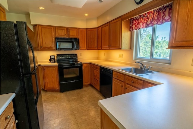 116 Diebold Rd, Robinson Twp Nwa, PA 15136 - kitchen featuring black appliances, a sink, light countertops, brown cabinets, and light tile patterned flooring