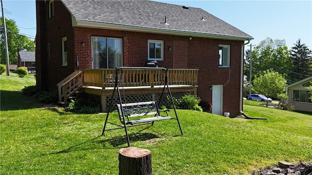 116 Diebold Rd, Robinson Twp Nwa, PA 15136 - rear view of property featuring roof with shingles, brick siding, a deck, and a lawn