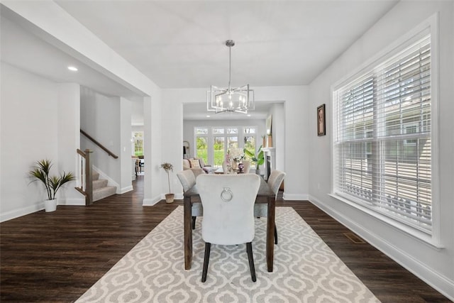 dining area with stairway, dark wood finished floors, a chandelier, baseboards, and recessed lighting