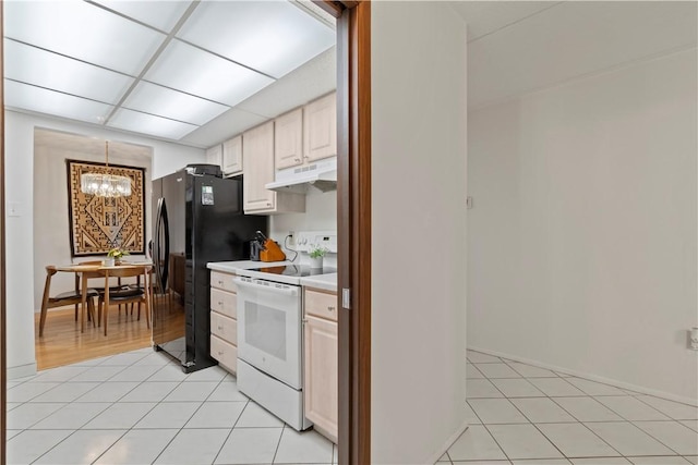 5600 Munhall Rd Unit 517, Squirrel Hill, PA 15217 - kitchen with white electric stove, under cabinet range hood, a chandelier, light countertops, and light tile patterned flooring