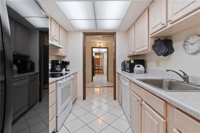 5600 Munhall Rd Unit 517, Squirrel Hill, PA 15217 - kitchen with white appliances, a sink, under cabinet range hood, light countertops, and light tile patterned floors