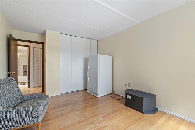 5600 Munhall Rd Unit 517, Squirrel Hill, PA 15217 - living area featuring light wood-style flooring and baseboards