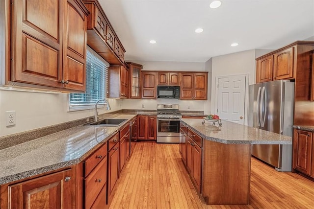 2108 Beams Run Rd, Jefferson Hills, PA 15025 - kitchen with stainless steel appliances, a sink, a kitchen island, brown cabinets, and recessed lighting