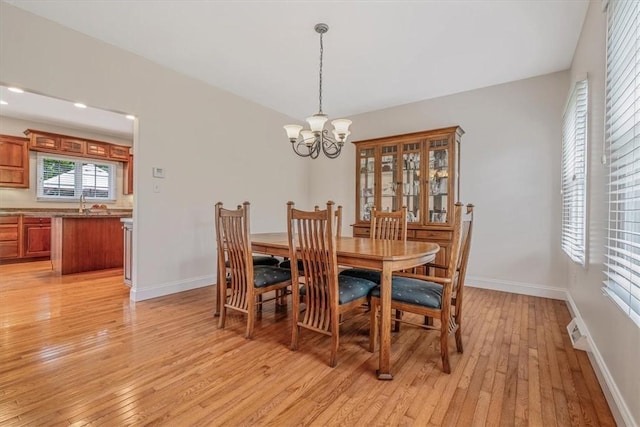 2108 Beams Run Rd, Jefferson Hills, PA 15025 - dining space with a chandelier, light wood-type flooring, and baseboards