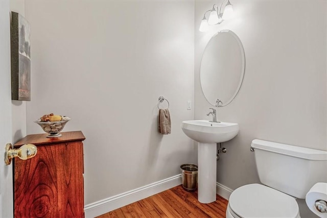 2108 Beams Run Rd, Jefferson Hills, PA 15025 - bathroom featuring wood finished floors, baseboards, toilet, and a sink