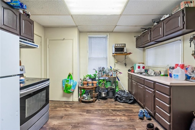 4974 Williamsport Rd, Elizabeth Twp/Boro, PA 15037 - kitchen featuring stainless steel electric stove, exhaust hood, freestanding refrigerator, dark brown cabinets, and wood finished floors
