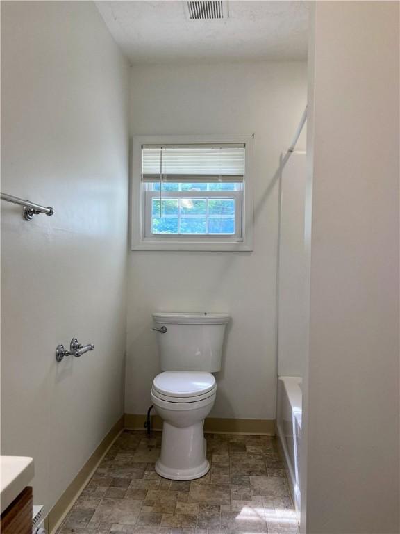 4974 Williamsport Rd, Elizabeth Twp/Boro, PA 15037 - bathroom with toilet, vanity, baseboards, and stone finish flooring