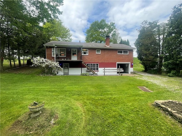 107 Pfaff Rd, Economy, PA 15005 - back of property featuring a chimney, a lawn, driveway, an attached garage, and brick siding