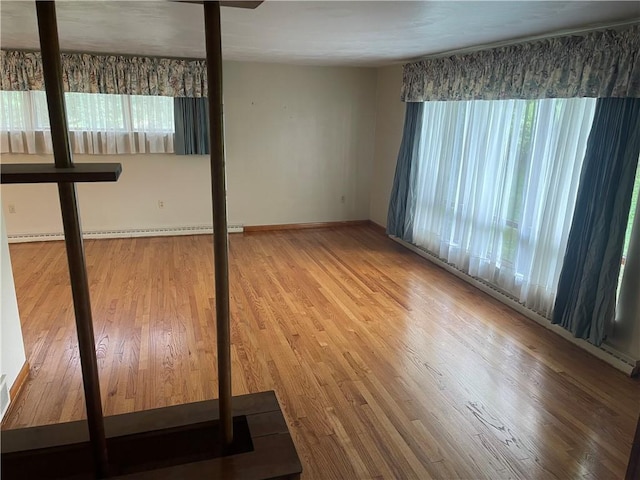 107 Pfaff Rd, Economy, PA 15005 - unfurnished room with healthy amount of natural light, wood finished floors, and baseboards