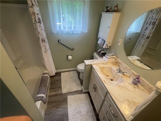 107 Pfaff Rd, Economy, PA 15005 - full bath with wood finished floors, vanity, toilet, shower / bath combo with shower curtain, and baseboards