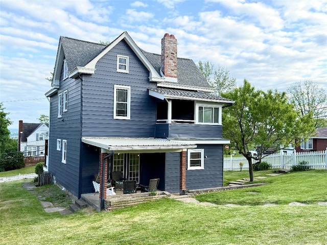 1701PLEASANT Pleasant, West Mifflin, PA 15122 - back of house featuring a chimney and a patio area