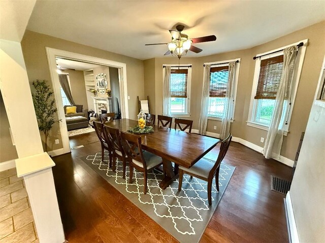 1701PLEASANT Pleasant, West Mifflin, PA 15122 - dining room with ceiling fan, baseboards, wood finished floors, and a fireplace