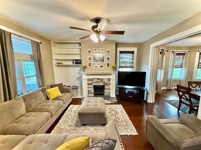 1701PLEASANT Pleasant, West Mifflin, PA 15122 - living area featuring ceiling fan, plenty of natural light, dark wood-style floors, and a fireplace