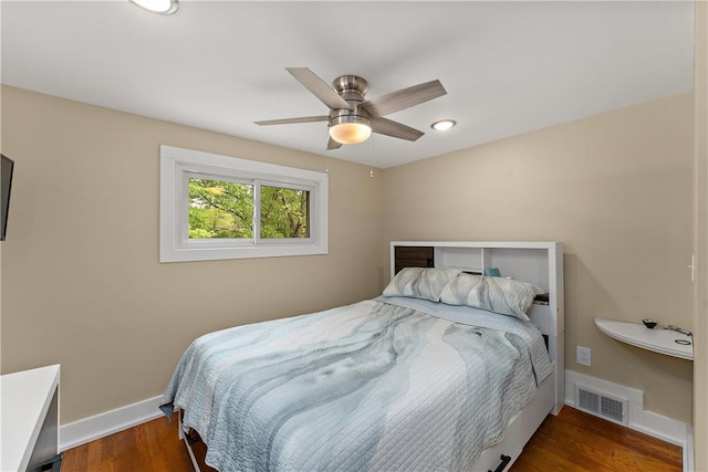 bedroom with baseboards, wood finished floors, a ceiling fan, and recessed lighting