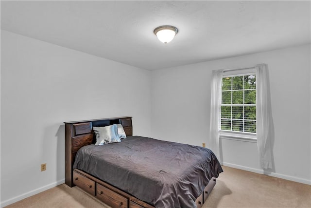 carpeted bedroom with baseboards