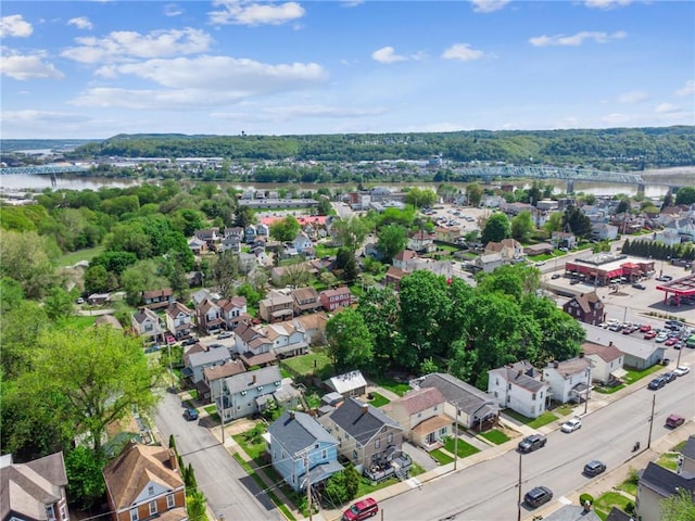aerial perspective of suburban area featuring a nearby body of water