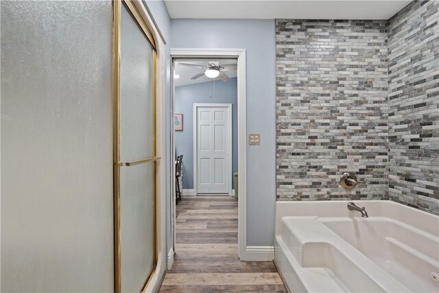 120 Dravo Ave, Beaver, PA 15009 - full bathroom featuring wood finished floors, a garden tub, an enclosed shower, ceiling fan, and baseboards