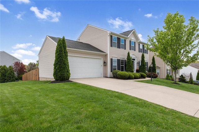 colonial-style house with an attached garage and driveway