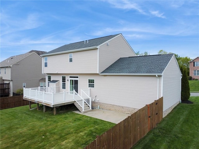 back of house featuring a wooden deck, a patio area, and a shingled roof