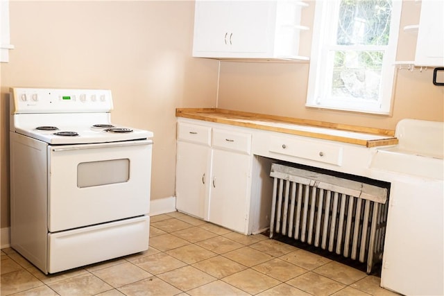 kitchen featuring white electric range, open shelves, white cabinetry, light countertops, and light tile patterned floors