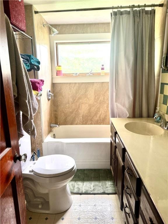 full bath featuring shower / bath combination with curtain, toilet, vanity, and tile patterned floors